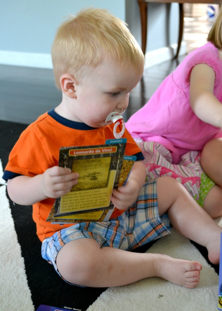 toddler with flashcards